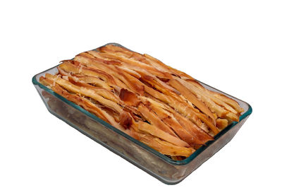 High angle view of cake against white background