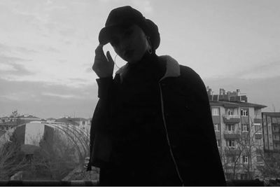 Man looking at cityscape against sky