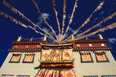 Low angle view of illuminated traditional building against sky at night