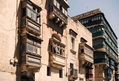 Low angle view of buildings against clear sky