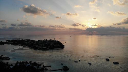 High angle view of beach against sky during sunset