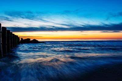 Scenic view of sea against sky during sunset