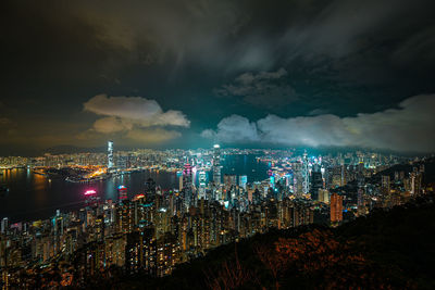 High angle view of illuminated city buildings at night