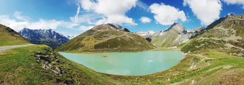 Panoramic view of lake and mountains against sky