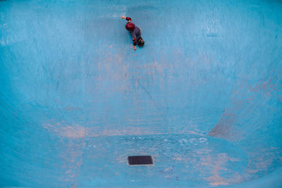 Man with umbrella in water