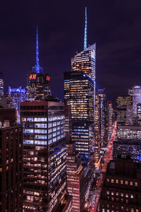 Illuminated buildings in city at night