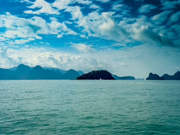 Scenic view of sea against cloudy sky