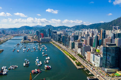 High angle view of harbor and buildings in city