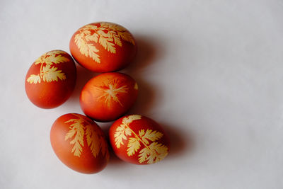 Close-up of oranges over white background