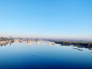 High angle view of cityscape against clear blue sky