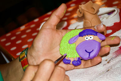 Close-up of hand holding toy