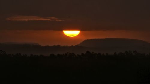 Scenic view of mountains at sunset