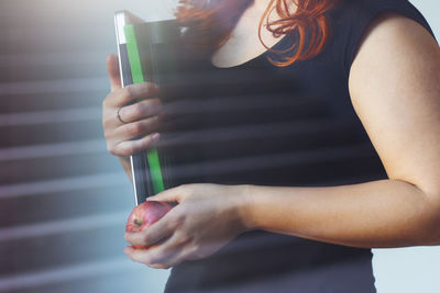 Midsection of woman holding hands