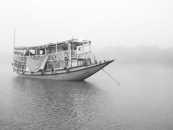 Ship on sea against sky during foggy weather