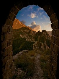 Scenic view of mountain against cloudy sky