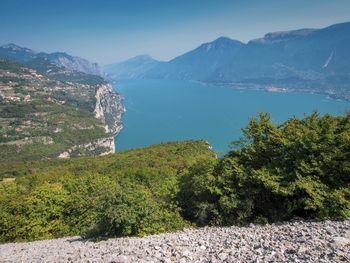 Scenic view of sea and mountains against sky