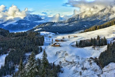 Scenic view of snow covered mountains against sky