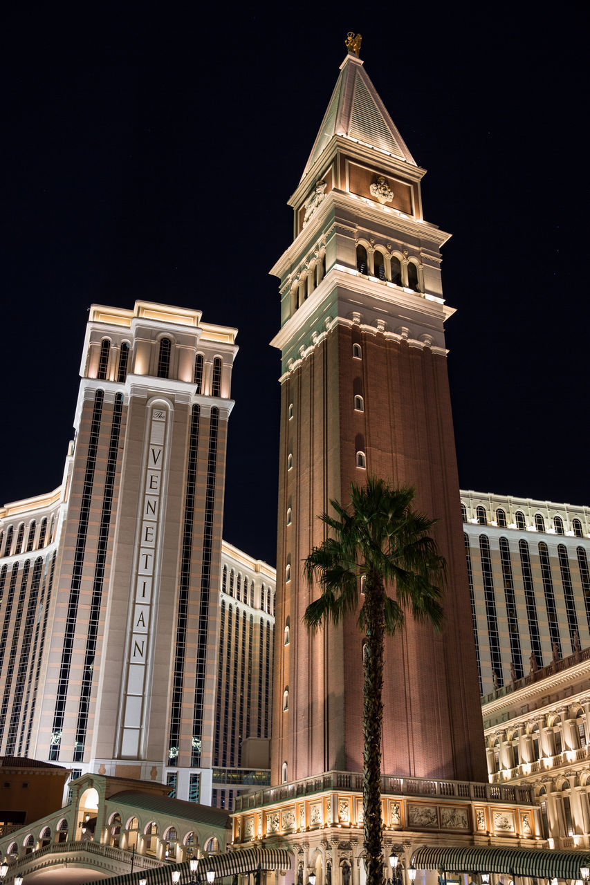 LOW ANGLE VIEW OF BUILDING AGAINST SKY AT NIGHT