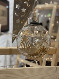 Close-up of illuminated lighting equipment hanging on table