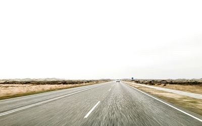 Empty road along landscape