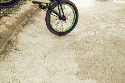 Low section of bicycle on dirt road