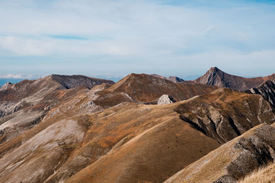 Scenic view of rocky mountains against sky in castelluccio, umbria italy 