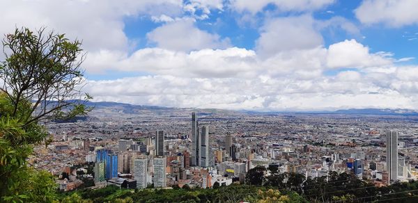 High angle view of buildings in city against sky