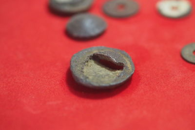 Close-up of coin on yellow background