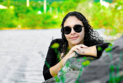 Portrait of young woman wearing sunglasses