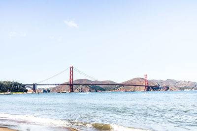 View of suspension bridge over sea