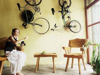 Man sitting on chair at home