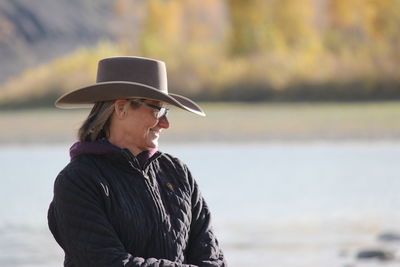 Horse  woman on riverside trail ride