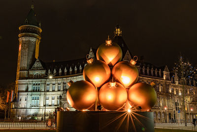 Low angle view of illuminated building at night