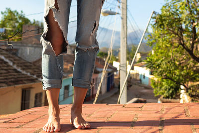 Close-up of female feets on the roof