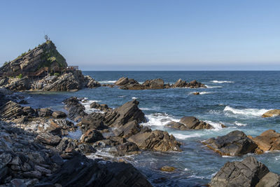 Scenic view of sea against clear sky