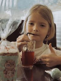 Close-up of girl drinking glass