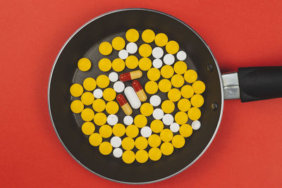 High angle view of multi colored candies in container