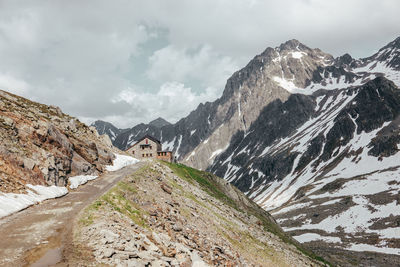 Scenic view of snow covered mountains against sky