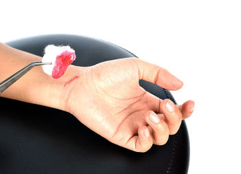 Close-up of woman hand holding black background