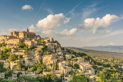 Aerial view of old town against cloudy sky