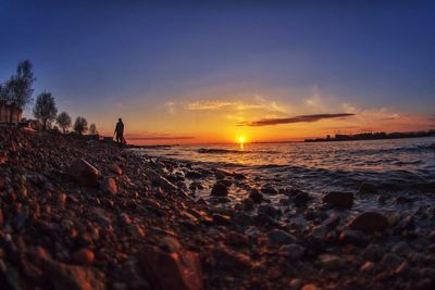 Scenic view of sea at sunset