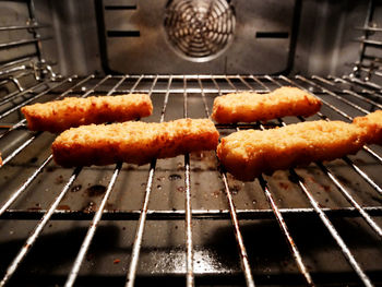 Close-up of fish fingers in oven