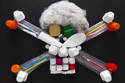 Close-up of toys on table against black background