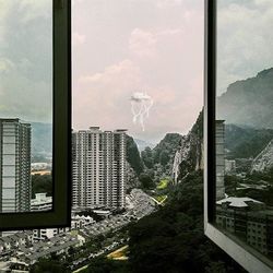 View of buildings against cloudy sky