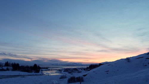 Scenic view of landscape against sky during sunset