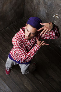 High angle view of man dancing on hardwood floor