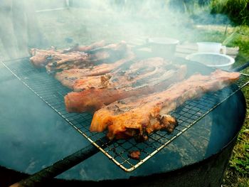 High angle view of meat on barbecue grill