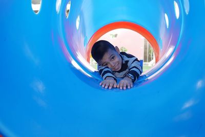 Portrait of young man in playground