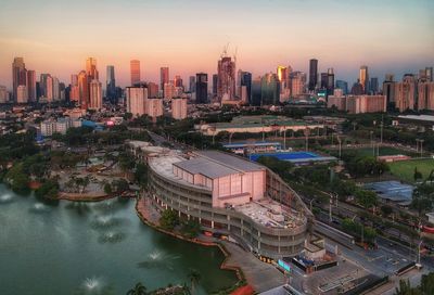 High angle view of river amidst buildings in city against sky