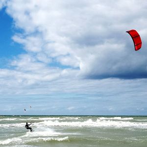 Person flying over sea